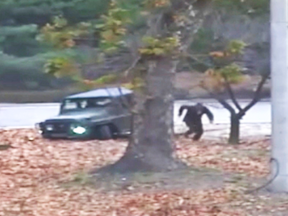 A North Korean soldier dashes toward the border to South Korea.