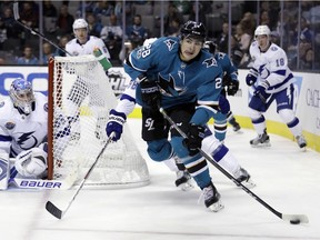 San Jose Sharks' Timo Meier, front, controls the puck against the Tampa Bay Lightning during the second period of an NHL hockey game Wednesday, Nov. 8, 2017, in San Jose, Calif. , AP