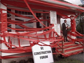 Red tape -- permits and fees -- add an average of $52,000 to every new home in Surrey and $78,000 per home in Vancouver.  
Les Bazso. [PNG Merlin Archive]