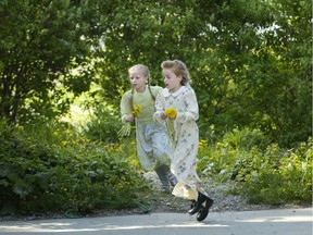 Elsie, left and Dolly gather flowers in May 2006 in Creston.