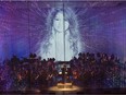 The National Arts Centre Orchestra's multimedia presentation of My Name is Amanda Todd, seen here on stage behing a scrim curtain, is part of Life Reflected, the opening event for World New Music Days 2017.