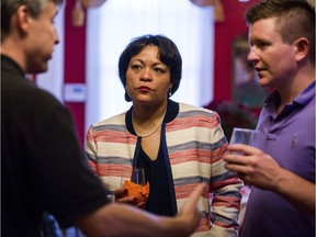 FILE - In this Sept. 22, 2017 file photo, New Orleans mayoral candidate LaToya Cantrell listens to donors at the home of Robert Ripley in New Orleans. On Saturday, Nov. 18, 2017, Cantrell and former municipal Judge Desiree Charbonnet were in a runoff that would determine which one would become the first woman elected to serve as New Orleans' mayor.