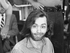 FILE - In this June 25, 1970 file photo, Charles Manson sticks his tongue out at photographers as he appears in a Santa Monica, Calif., courtroom, charged with the slaying of musician Gary Hinman. Authorities say Manson, cult leader and mastermind behind 1969 deaths of actress Sharon Tate and several others, died on Sunday, Nov. 19, 2017. He was 83. (AP Photo, File)