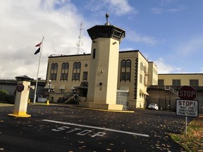 FILE - This Nov. 18, 2011 file photo shows the Oregon State Penitentiary, in Salem, Ore. An Oregon woman was sentenced to two years in federal prison in Portland, Ore., Tuesday, Nov. 21, 2017, on a drug conspiracy charge after her inmate boyfriend died from a meth-laden kiss at the Oregon State Penitentiary after a prison visit in 2016. (Danielle Peterson/Statesman-Journal via AP, File)