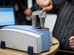 An infrared spectrometer is used to test street heroin for fentanyl during a demonstration at the supervised consumption site at Powell Street Getaway in the Downtown Eastside of Vancouver.