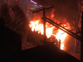 A party bus burns on Granville Street on Saturday night.