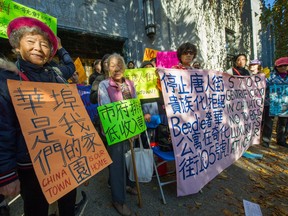 Chinatown residents rally in front of City Hall in Vancouver, B.C., October 30, 2017 to protest a revised plan for 105 Keefer Street.