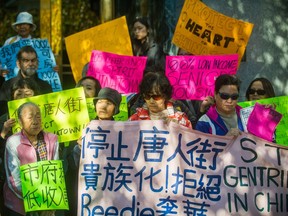 FILE PHOTO - Chinatown residents rally in front of City Hall in Vancouver, B.C., October 30, 2017 opposing a development plan in their neighbourhood.