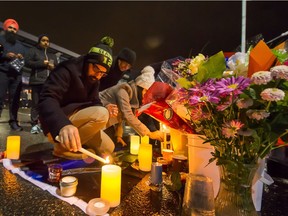 People attend a vigil for Const. John Davidson at Mount Lehman Centre mall in Abbotsford.