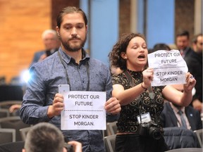 Anti-Kinder Morgan protesters Jake Hubley and Hayley Zacks heckle Prime Minister Justin Trudeau at the UN Peacekeeping Defence Ministerial Conference in Vancouver, BC., November 15, 2017.