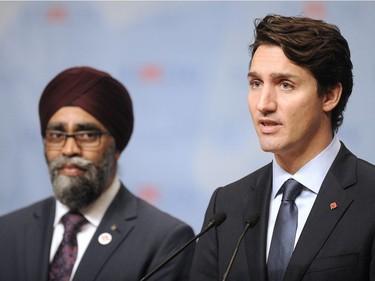 Prime Minister Justin Trudeau, with Minister of Defence Harjit Sajjan speaks to media following the Opening Plenary of the UN Peacekeeping Defence Ministerial Conference in Vancouver, BC., November 15, 2017.