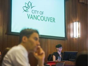 Vancouver Coun. Andrea Reimer, right, and Mayor Gregor Robertson listen to speakers at Vancouver City Hall in late November before approving 10-year housing strategy linked to latest property tax hike.