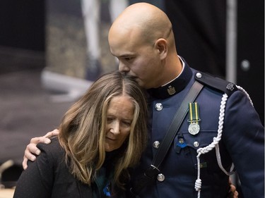 Denise Davidson, Kiyomi Parsons

Denise Davidson, left, is comforted by Cnst. Kiyomi Parsons after he read a statement on her behalf about her late husband Abbotsford Police Const. John Davidson, who was killed in the line of duty on November 6, during a memorial service for him in Abbotsford, B.C., on Sunday November 19, 2017. THE CANADIAN PRESS/Darryl Dyck ORG XMIT: VCRD119
DARRYL DYCK,