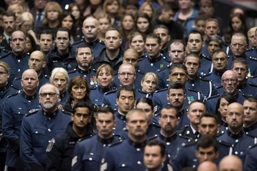 Abbotsford Police officers stand during a memorial service for Abbotsford Police Const. John Davidson, who was killed in the line of duty Nov. 6, in Abbotsford on Sunday, Nov. 19, 2017.
