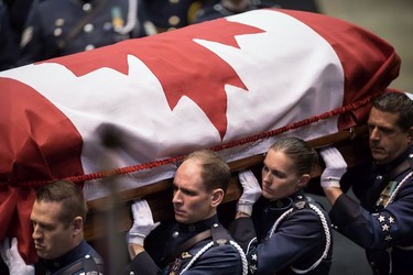 Pallbearers carry the casket of Abbotsford Police Const. John Davidson, who was killed in the line of duty Nov. 6, into a memorial service in Abbotsford on Sunday, Nov. 19, 2017.