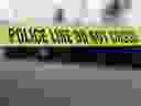 Police tape at a crime scene.