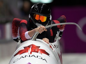 In this Feb. 19, 2014 file photo, Canada's Kaillie Humphries and Heather Moyse compete in women's bobsleigh at the Sochi Olympics.