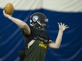 Windsor Dukes quarterback Ryan Baker puts some mustard on his throw during practice this week in North Vancouver. ‘During football season, I’m all in with football. When it switches, I’m full baseball mode,’ says the high-school senior two-sports star.