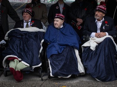 Veterans, including Patrick Drake, centre, 92, who served in the Second World War, sit in wheelchairs during a Remembrance Day ceremony in Vancouver, B.C., on Saturday November 11, 2017.