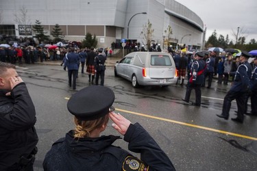 Crowds gather for a final goodbye as a hearse carrying the body of Abbotsford Police Const. John Davidson makes its way through the streets of Abbotsford on Sunday, Nov. 19, 2017. Davidson was shot and killed in the line of duty on Nov. 6.