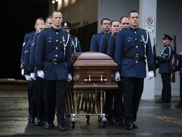 Pallbearers prepare to carry the body of Const. John Davidson after his service in Abbotsford on Nov. 19, 2017.