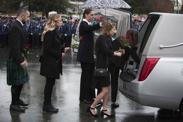 Const. John Davidson

The family of Const. John Davidson place roses on his casket after his service in Abbotsford on Nov. 19, 2017.