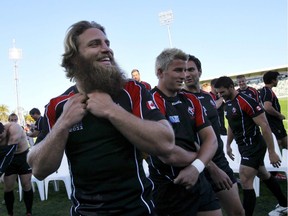 Canada's Adam Kleeberger, centre, prepares for the captain's run following a group photo with teammates in Napier, New Zealand in 2011. Kleeberger, who won 38 caps for his country and drew worldwide attention as one of Canada's "beardos," is looking to help others follow his rugby footsteps.