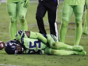 Seattle Seahawks cornerback Richard Sherman (25) lies injured on the turf after tackling Arizona Cardinals wide receiver John Brown (12) during the second half of an NFL football game, Thursday, Nov. 9, 2017, in Glendale, Ariz. Sherman did not return to the game after the injury.