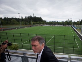 Vancouver Whitecaps President Bob Lenarduzzi overlooks the pitch at the MLS soccer team's new National Soccer Development Centre training facility at the University of British Columbia. The Whitecaps have folded their local feeder team.