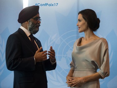 Defence Minister Harjit Sajjan, left, and UNHCR Special Envoy Angelina Jolie talk during a photo opportunity before her keynote address at the 2017 United Nations Peacekeeping Defence Ministerial conference in Vancouver, B.C., on Wednesday November 15, 2017.