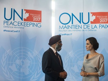 Defence Minister Harjit Sajjan, left, and UNHCR Special Envoy Angelina Jolie talk during a photo opportunity before her keynote address at the 2017 United Nations Peacekeeping Defence Ministerial conference in Vancouver, B.C., on Wednesday November 15, 2017.