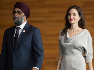 Defence Minister Harjit Sajjan, left, and UNHCR Special Envoy Angelina Jolie talk during a photo opportunity before her keynote address at the 2017 United Nations Peacekeeping Defence Ministerial conference in Vancouver, B.C., on Wednesday November 15, 2017.