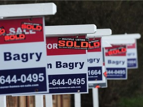 For Sale signs on Grandview Highway in Vancouver, BC., February 29, 2016.