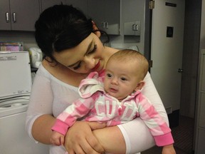 Tanis Hanson, shown here with her four-month-old baby Zaylia, is a student at Coquitlam Alternative Basic Education, where falf the school’s 200 students are living with someone other than a parent.