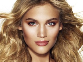 A model wears the "Golden Goddess" look created by Charlotte Tilbury.