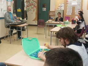 Music therapist Don Hardy leads special needs students at Burnaby Central Secondary in a jam session, while life skills teacher Inderjeet Ranu looks on.