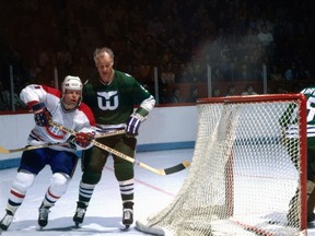 Gordie Howe of the Hartford Whalers skates against Doug Jarvis of the Montreal Canadiens during as NHL game in Montreal during the 1979-80 season.