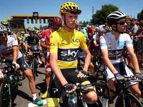 In this July 16, 2017 file photo, Chris Froome (centre) prepares to ride in the 15th stage of the Tour de France, which he eventually won.