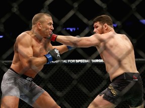 Georges St-Pierre of Canada fights Michael Bisping of England in their UFC middleweight championship bout during the UFC 217 event at Madison Square Garden on November 4, 2017 in New York City.