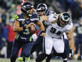 Quarterback Russell Wilson of the Seahawks scrambles in the third quarter against the Philadelphia Eagles at CenturyLink Field on Dec. 3 in Seattle.