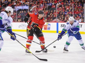 After lobbying for more playing time, veteran Thomas Vanek of the Vancouver Canucks, right, pulled a disappearing act against the Calgary Flames on Saturday, writes Postmedia columnist Ed Willes.