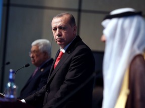 Turkish President Recep Tayyip Erdogan, centre, Palestinian President Mahmoud Abbas, left, and Organization of Islamic Cooperation's Secretary General Yousef Al-Othaimeen, right, holding a press conference on Jerusalem.