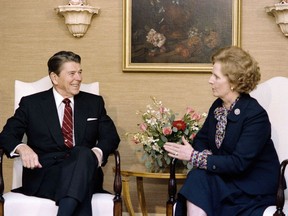 This file photo taken on October 23, 1985 shows US President Ronald Reagan (L) holding a bilateral meeting with British Prime Minister Margaret Thatcher (R) at the Waldorf Astoria Hotel. Margaret Thatcher refused a request to fly a panda in the back of her Concorde when she visited Washington for her first summit with Ronald Reagan, according to papers released on December 29, 2017.