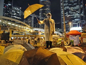 A protester holds an umbrella during mass demonstrations outside government headquarters in Hong Kong in 2014.