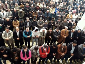 In this photo released by the Syrian official news agency SANA, Syrian citizens pray for rain during the Friday prayer, in Hasakeh city, east Syria, Friday, Dec. 29, 2017. Syrian President Bashar Assad directed imams to pray for rain in this week's prayers through a circular distributed by the Religious Affairs Ministry, SANA state news agency reported Tuesday.