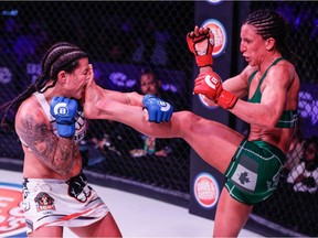 Port Moody's Julia Budd, right, battles with Arlene Blencowe on her way to a split decision victory at Bellator 189 in Thackerville, Okla., retaining her the Bellator featherweight title.