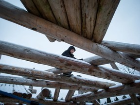 Kyle Hutchinson, 12, climbs on a wood playground at Rochester Park in Coquitlam on Thursday December 21, 2017. Cities across Canada are rethinking their park spaces as play changes, replacing teeter-totters, golf courses and baseball diamonds with space for cricket, pickleball and play structures for all ages.