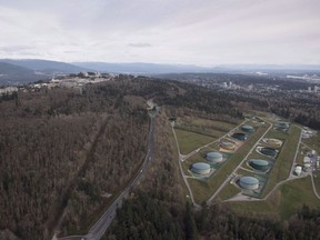 Kinder Morgan Trans Mountain Expansion Project's oil storage tank farm, at right with green tanks, is seen in Burnaby, B.C., on Nov. 25, 2016.
