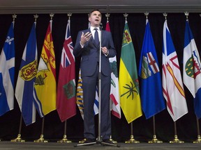 Finance Minister Bill Morneau speaks with the media following meetings with his provincial counterparts in Ottawa on June 19, 2017. A cross-country squabble over how best to divvy up the proceeds of Canada's coming legal-weed windfall is about to intensify as finance ministers gather for high-stakes talks in Ottawa. For the provinces and territories, a key question looms: what entitles Ottawa to claim so much as half of the tax revenues that will start flowing when marijuana is legalized next summer?