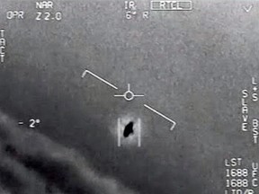 In an undated handout image taken from a video released by the Defense Department's Advanced Aerospace Threat Identification Program shows a 2004 encounter near San Diego between two Navy F/A-18F fighter jets and an unknown object.